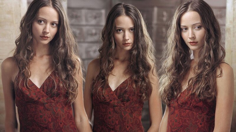 three women in red dresses