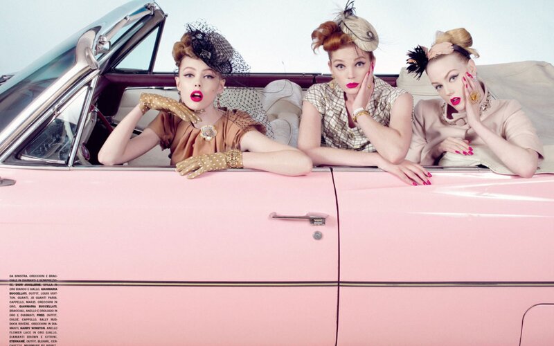 Three women in vintage car