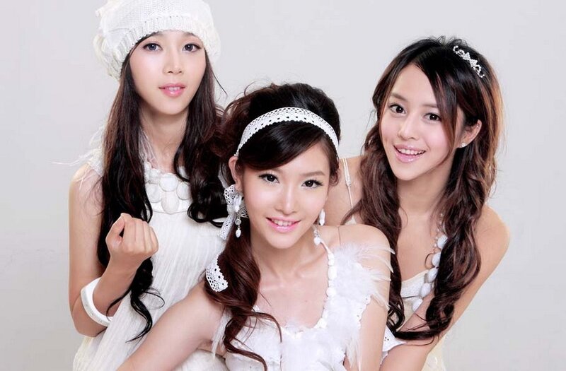 three women in white dresses