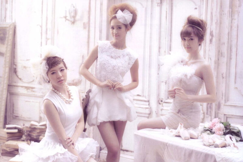Three women in white dresses