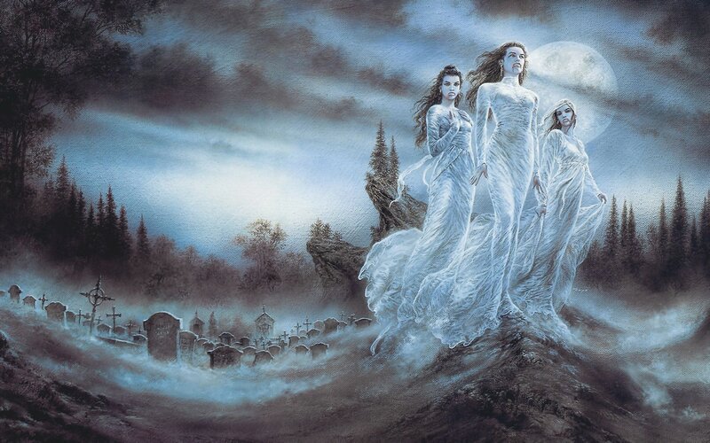 Three women in white on a hill