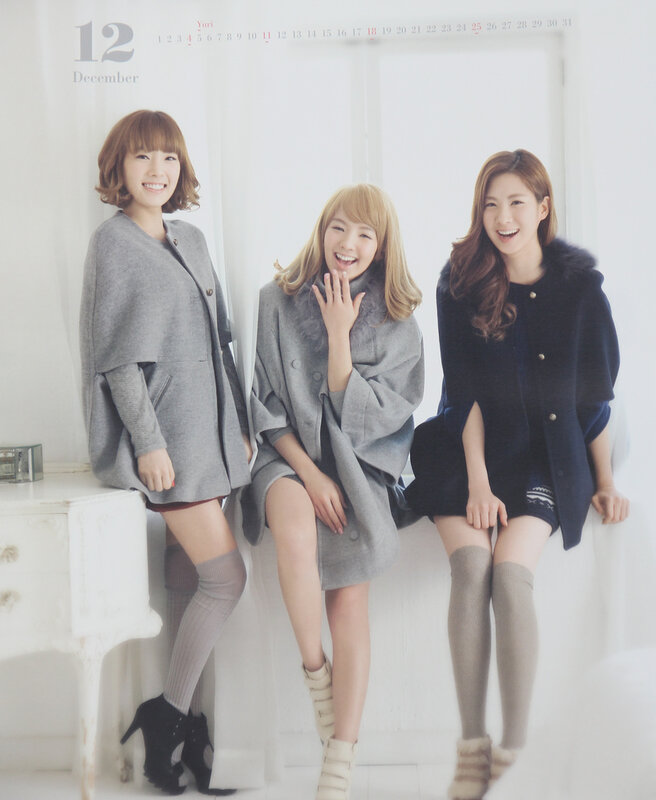 three women in winter coats
