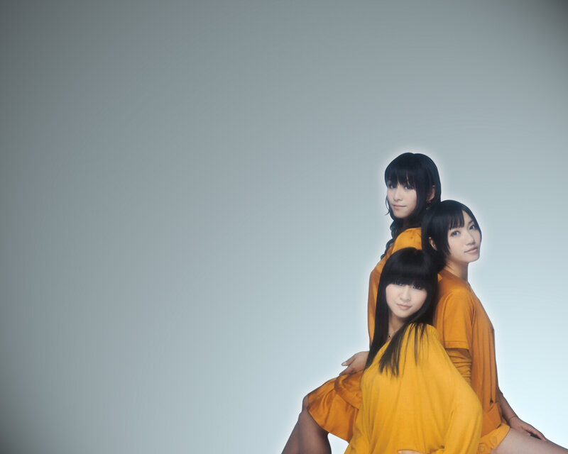 three women in yellow dresses