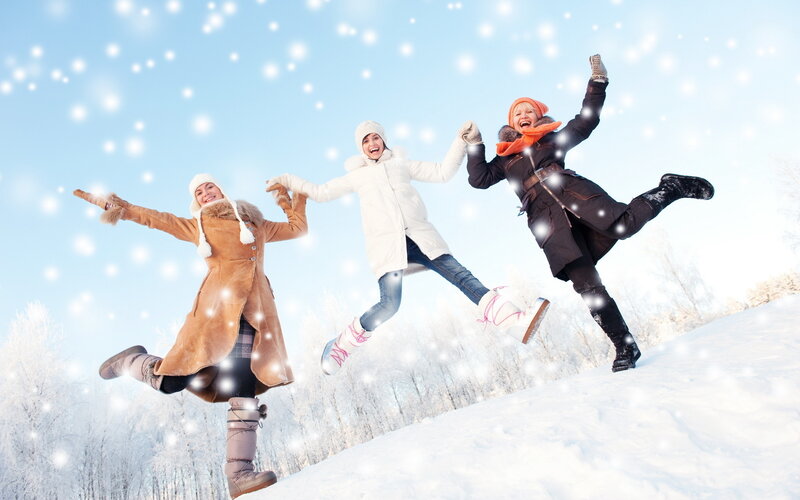 Three Women Jumping in Snow