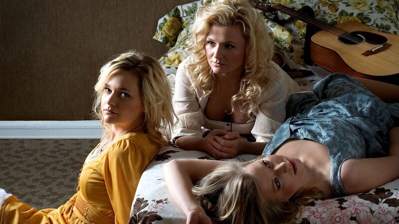 Three women on a floral bed