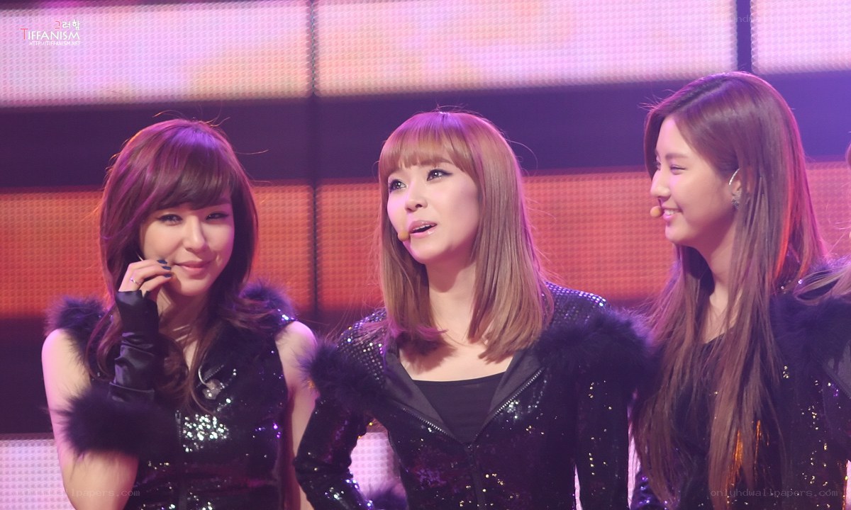 three women on stage