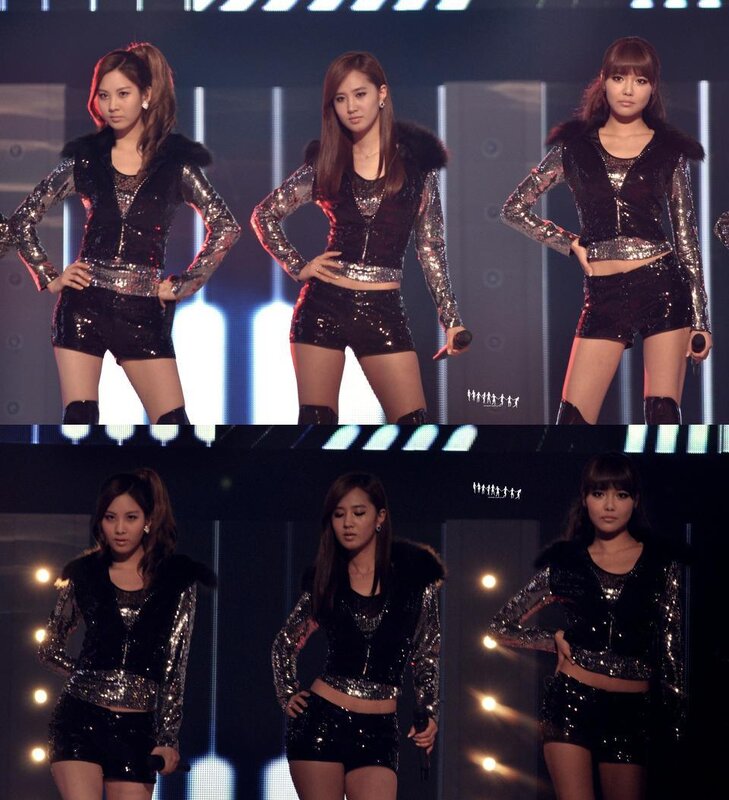 three women on stage in sequined outfits