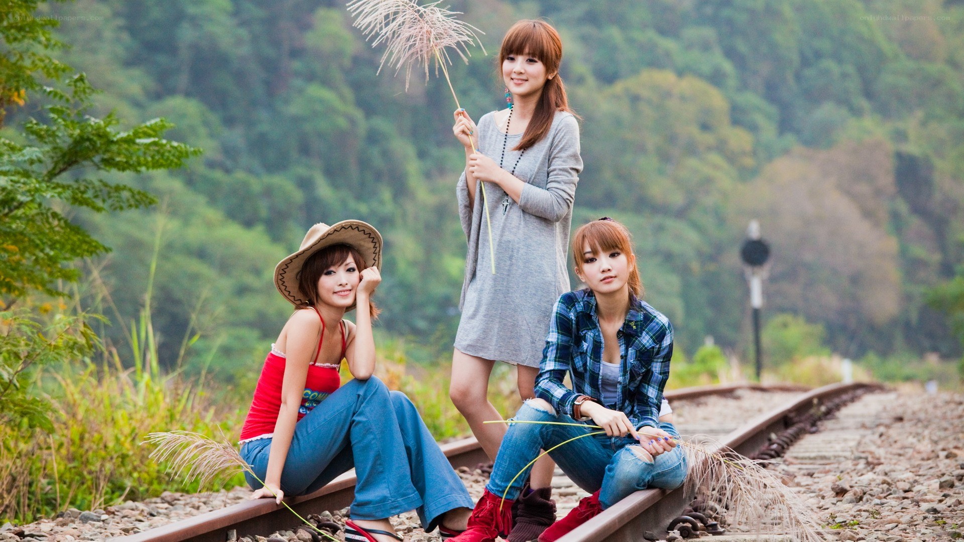 Three women on train tracks