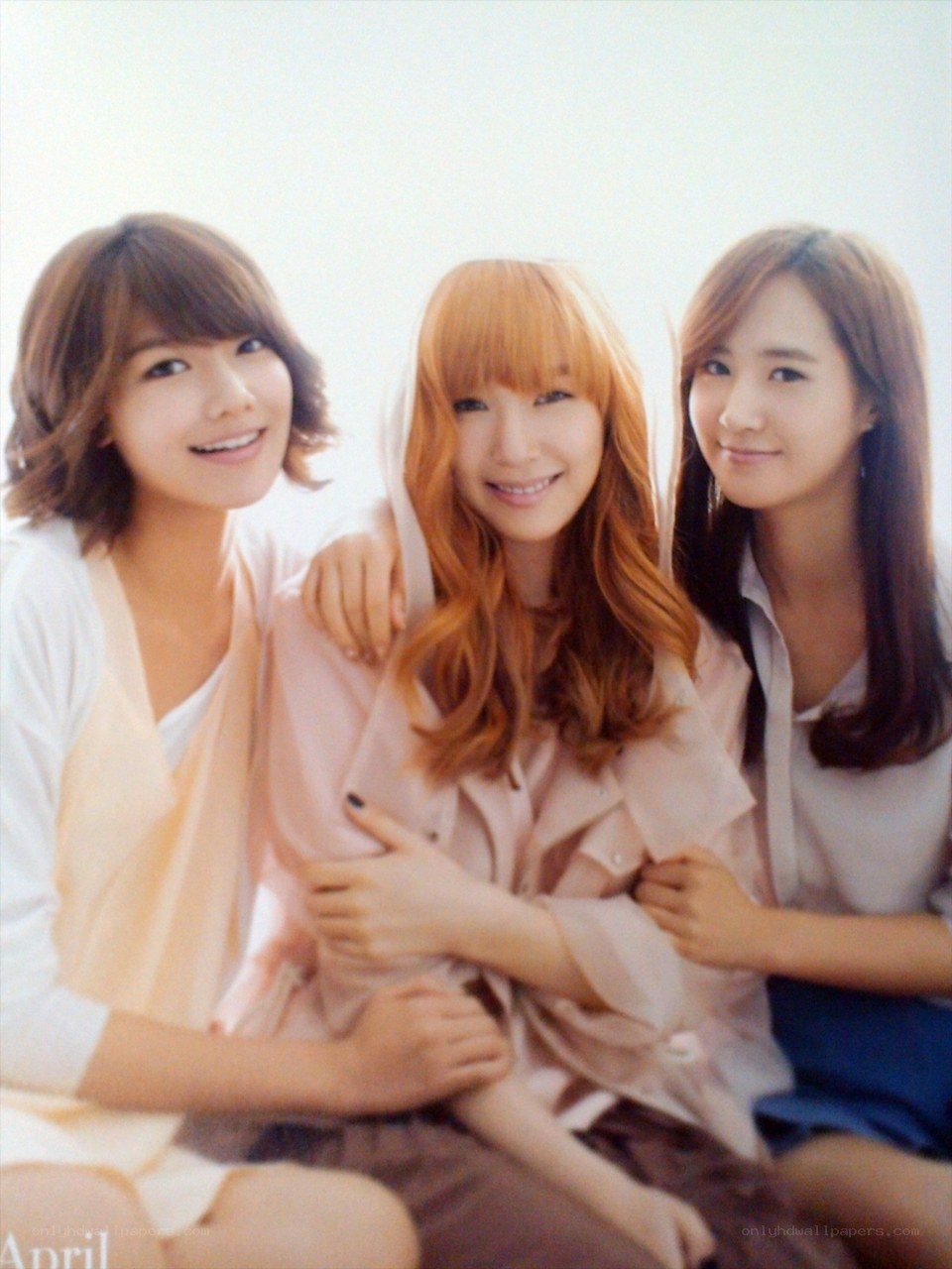 three women posing together