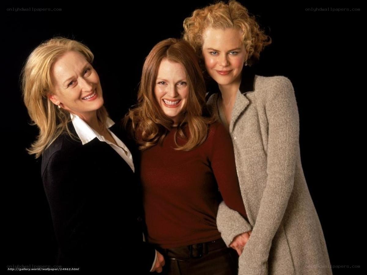 three women posing together