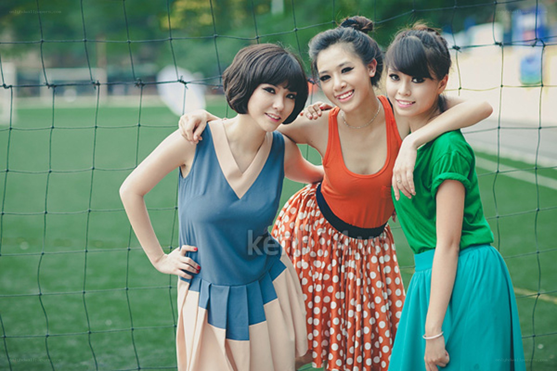 Three women posing together