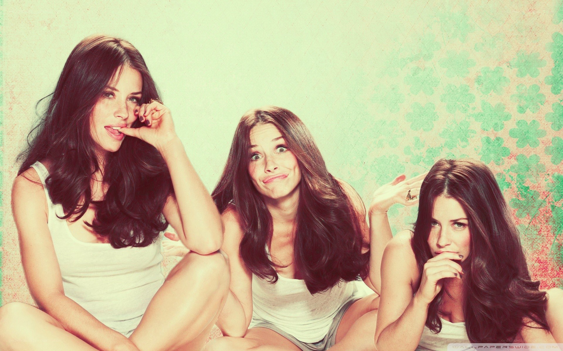 three women posing together