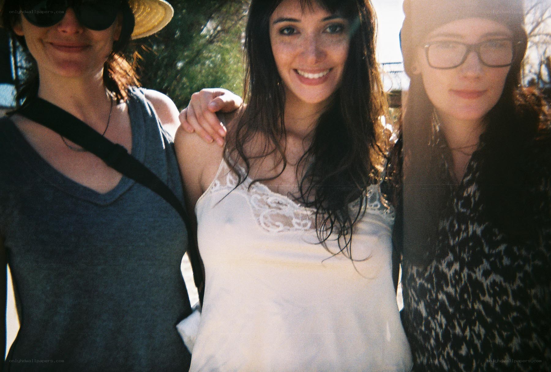 three women posing together