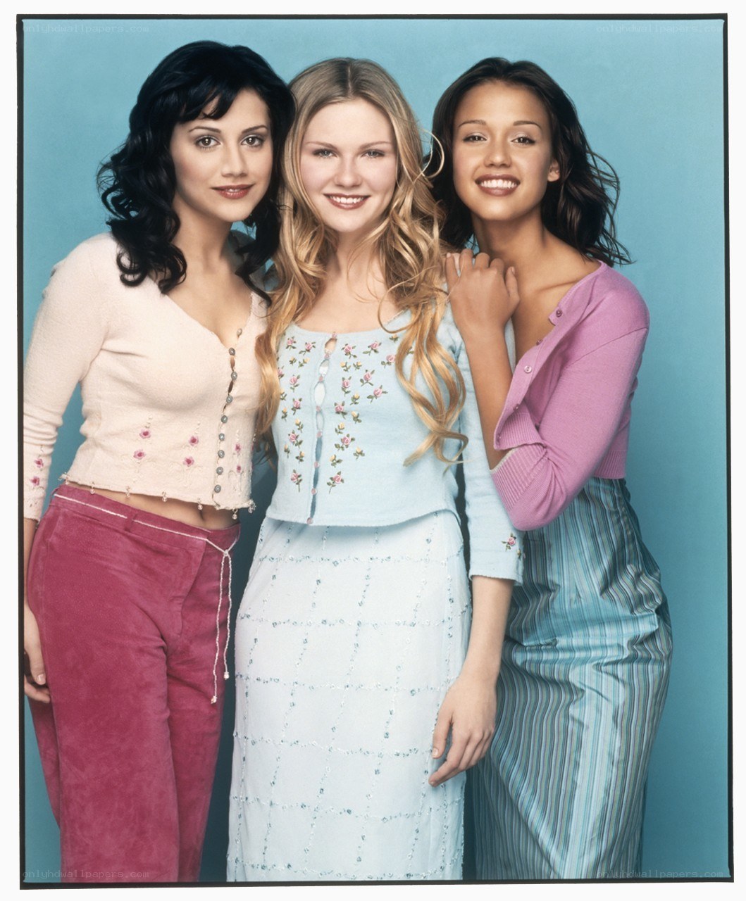 three women posing together