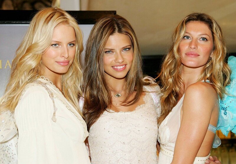 Three Women Posing Together — White