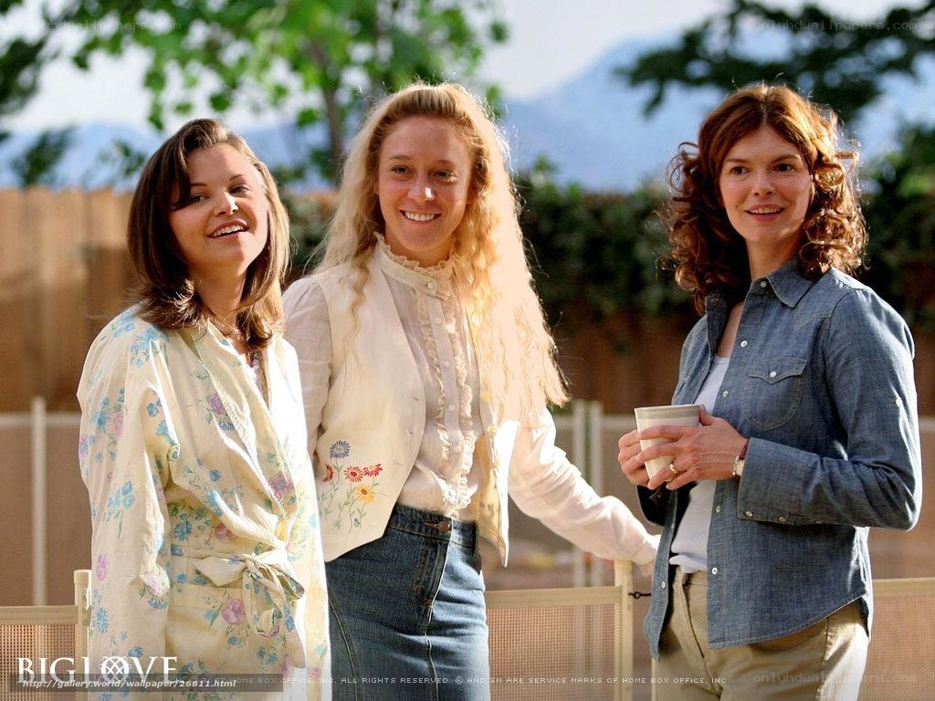 Three women smiling outdoors