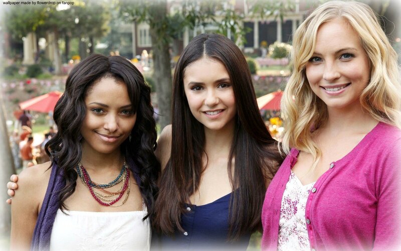 three women smiling together