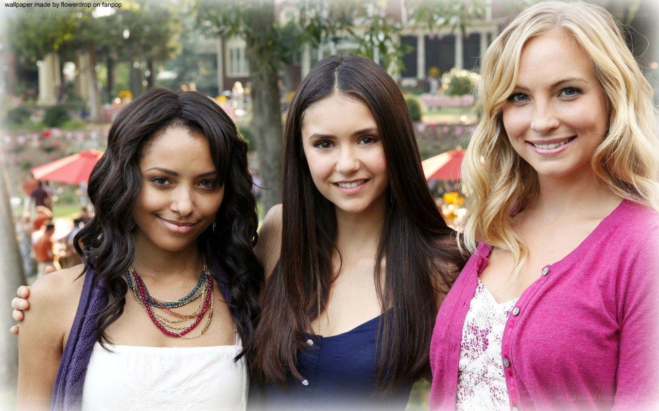 three women smiling together