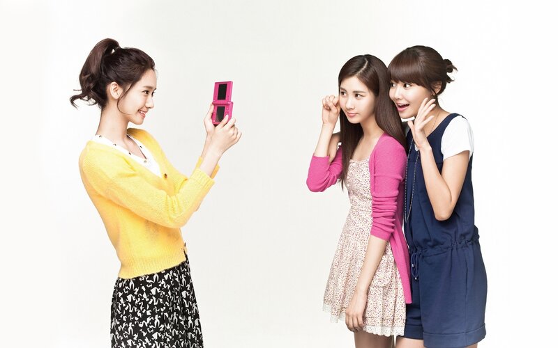 three women taking a photo