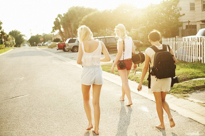 three women walking on a street