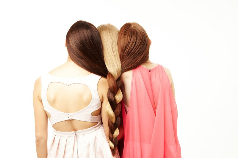 three women with braided hair