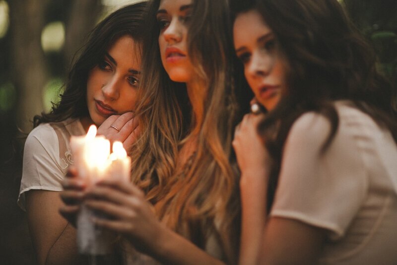 Three women with candles