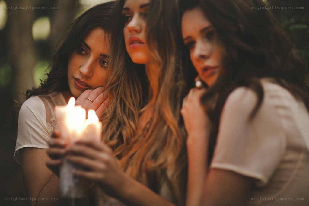 Three women with candles