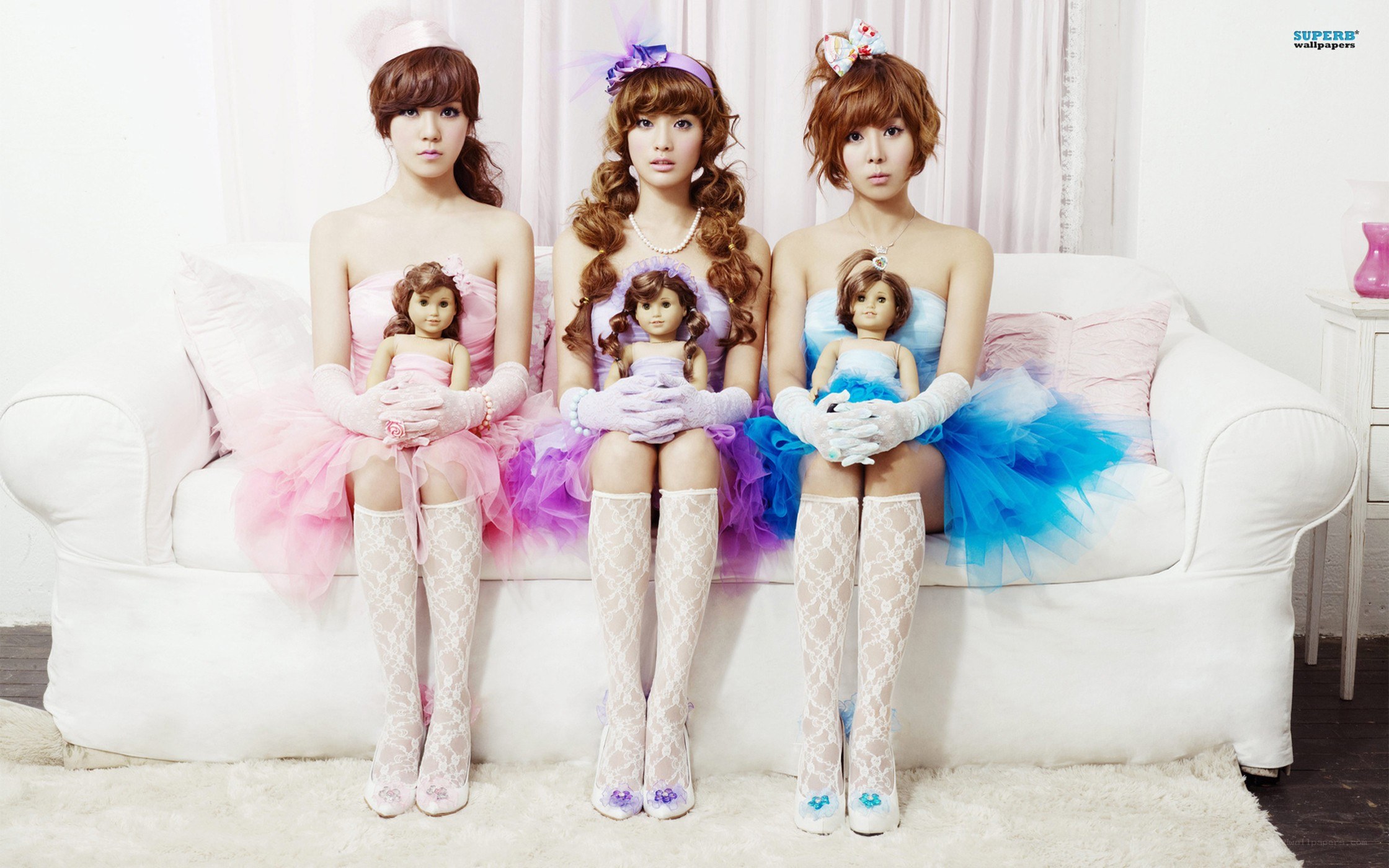 three women with dolls
