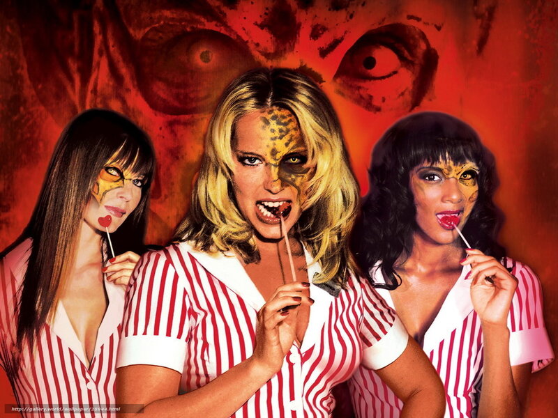 Three women with lollipops and face paint