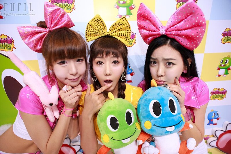 Three women with plush toys