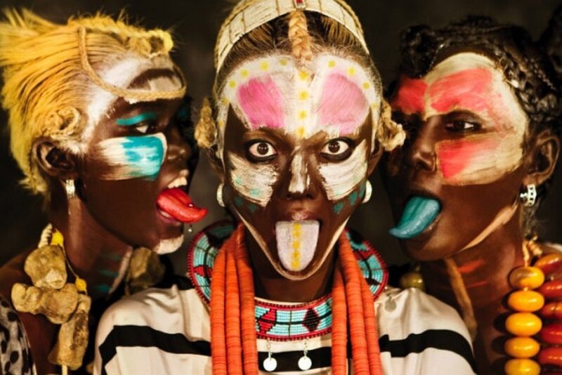Three women with traditional face paint