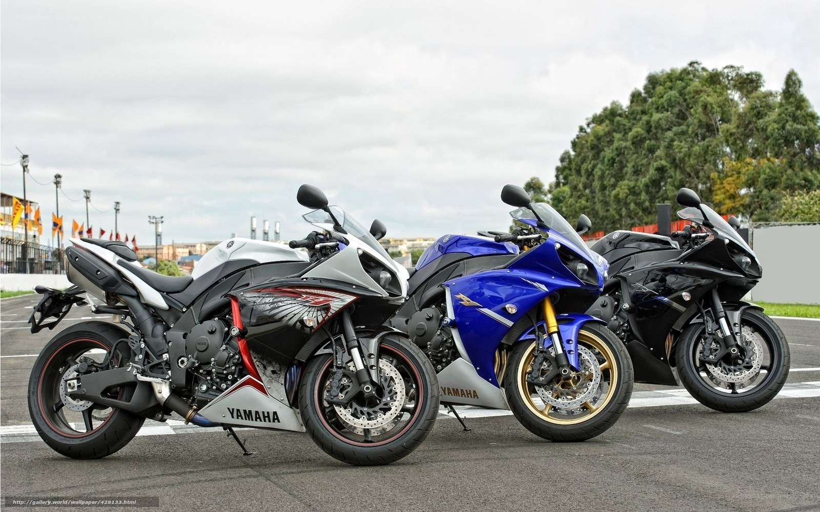 Three Yamaha sport motorcycles