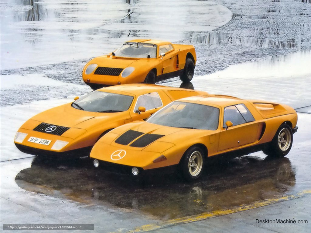 Three yellow Mercedes-Benz race cars