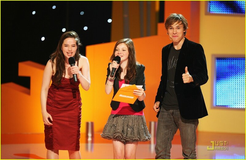 Three young hosts on stage