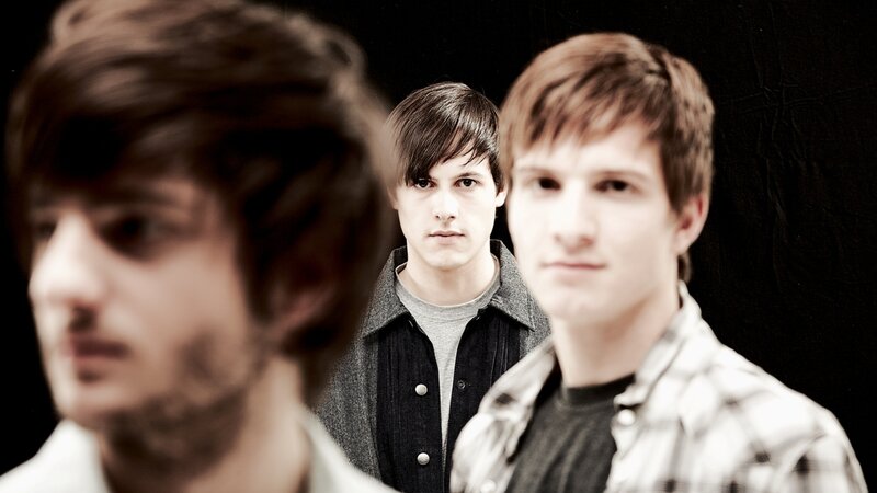 three young men in a group