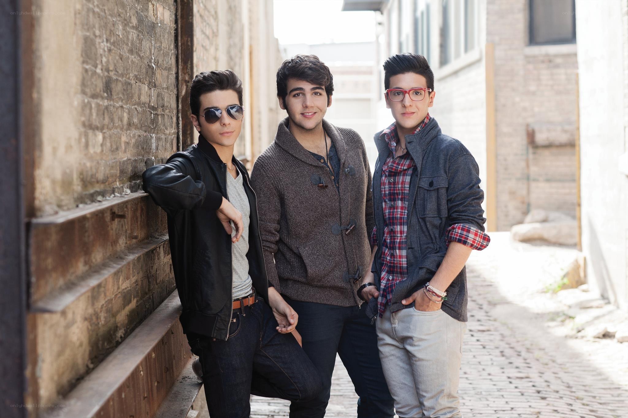 three young men in alley