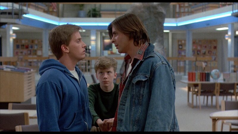Three Young Men in Library