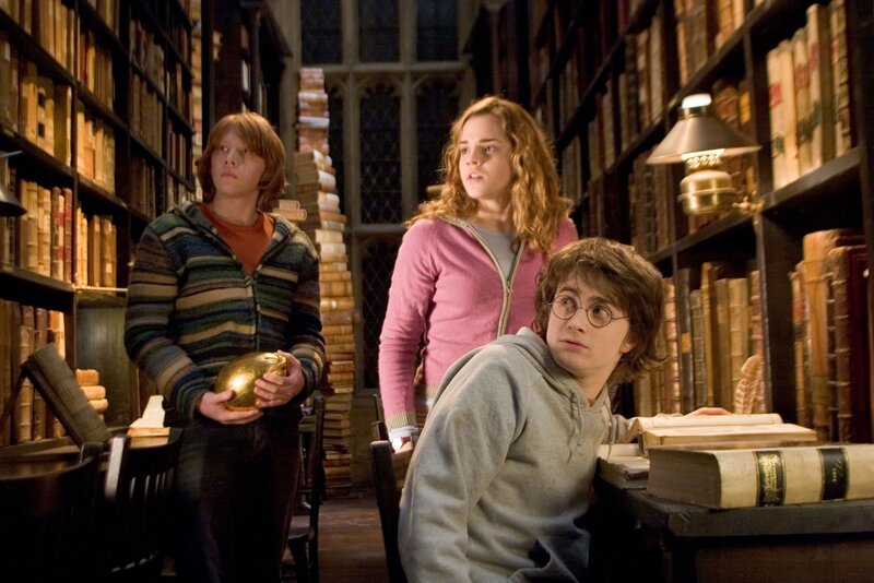 Three Young People in Library — Brown