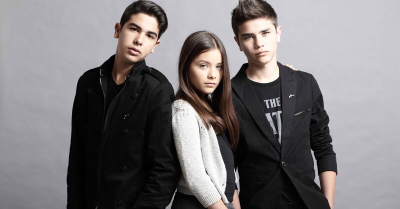 three young people posing together