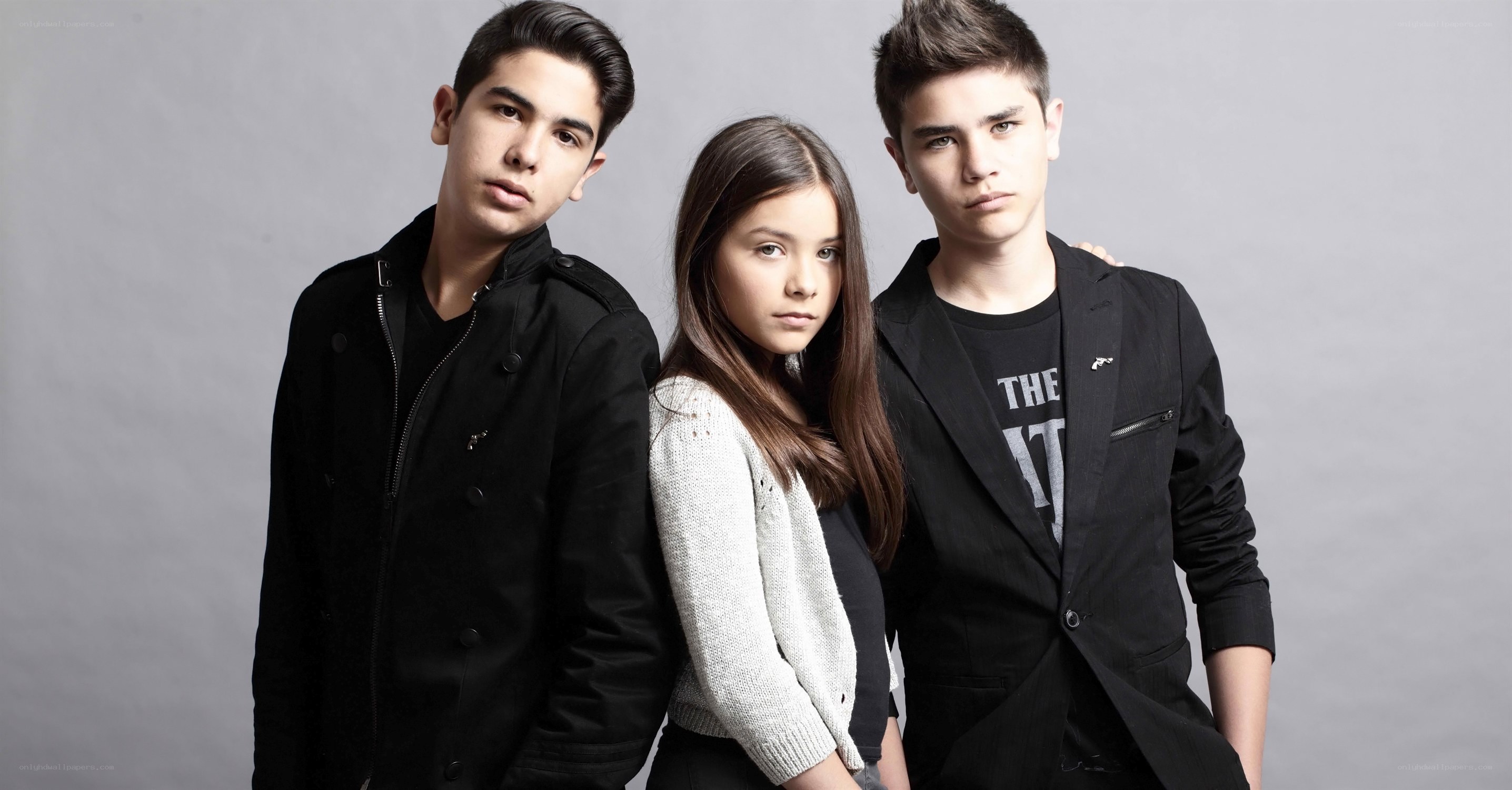 three young people posing together