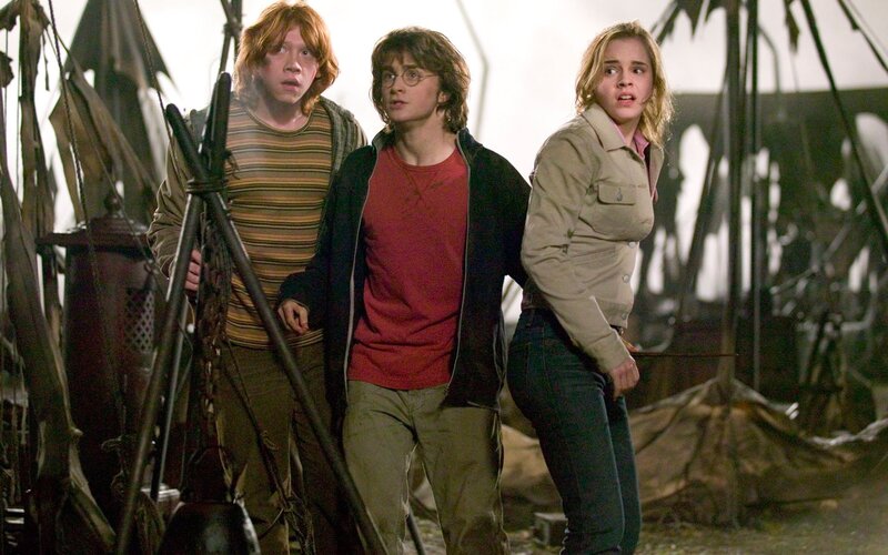 Three Young People Standing — Brown, Dramatic