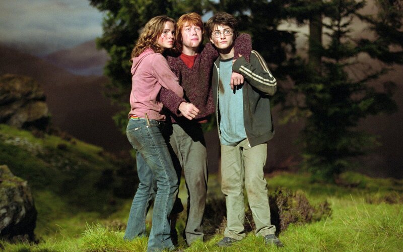 Three Young People Standing — Green, Dramatic