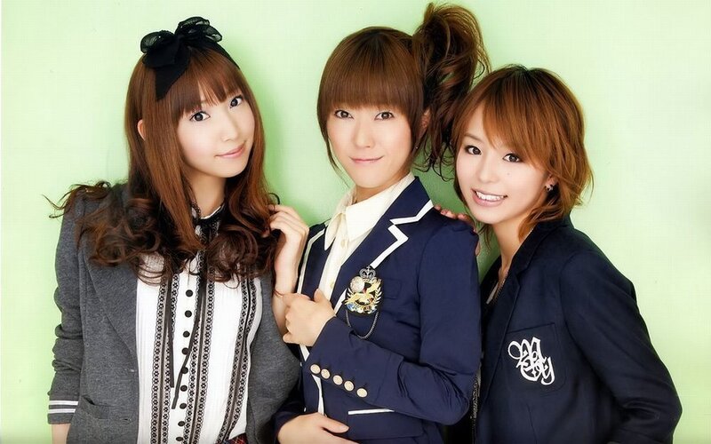 three young women in school uniforms
