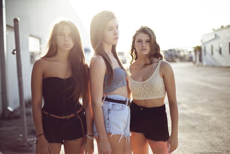 three young women in streetwear