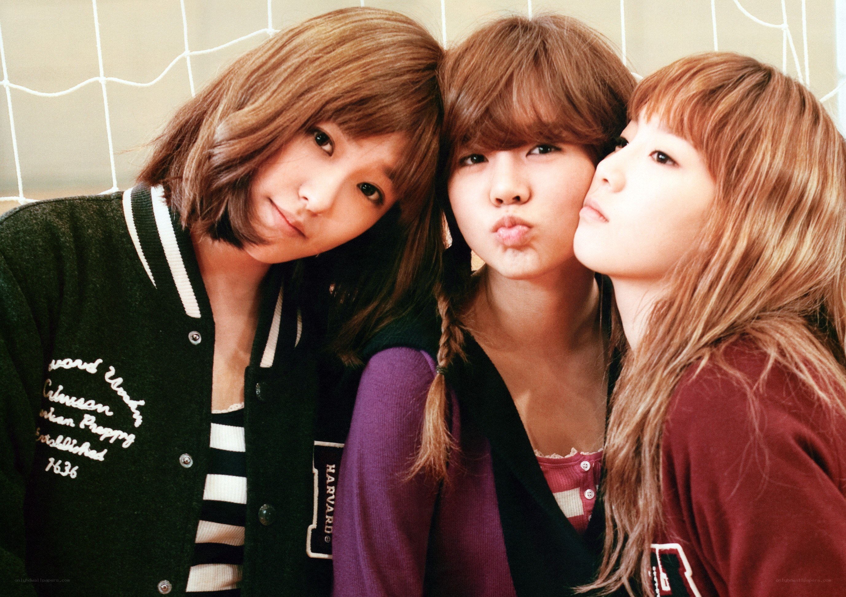 three young women posing together