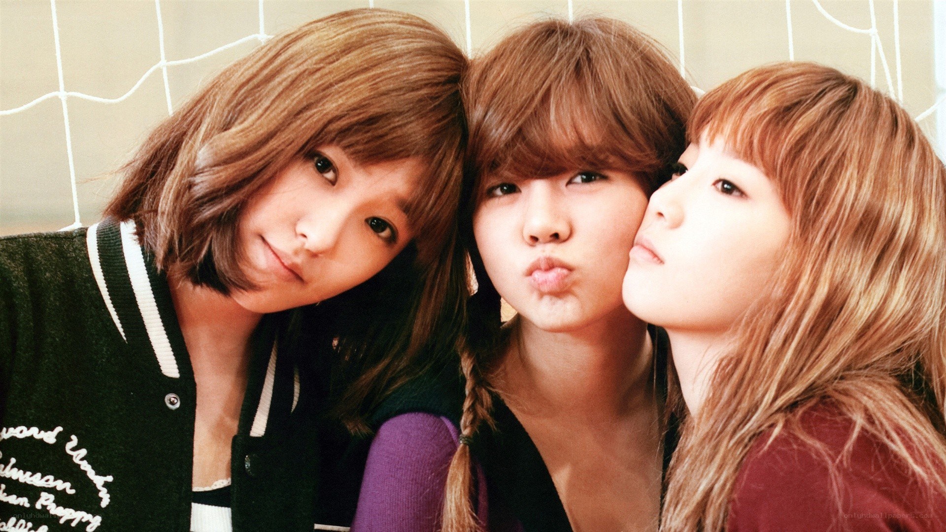 three young women posing together