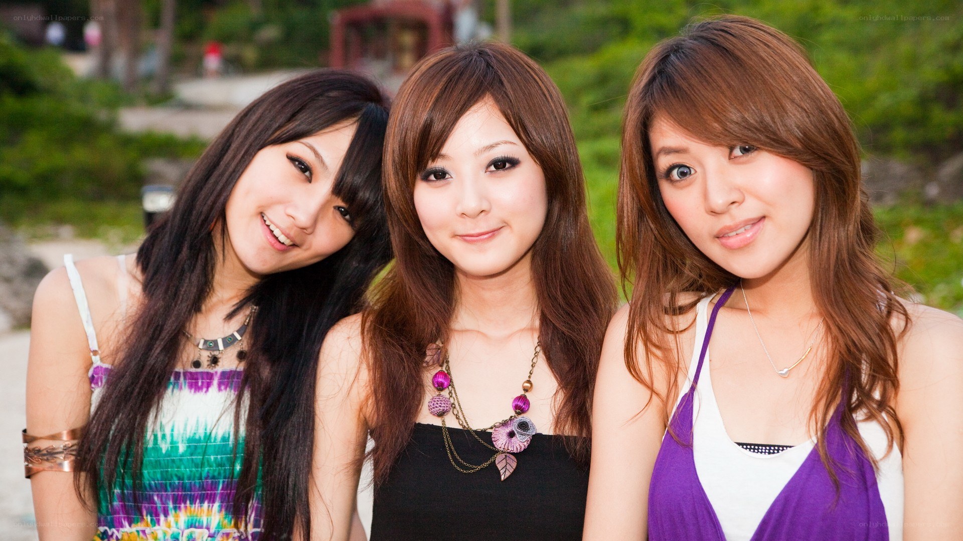 three young women posing together