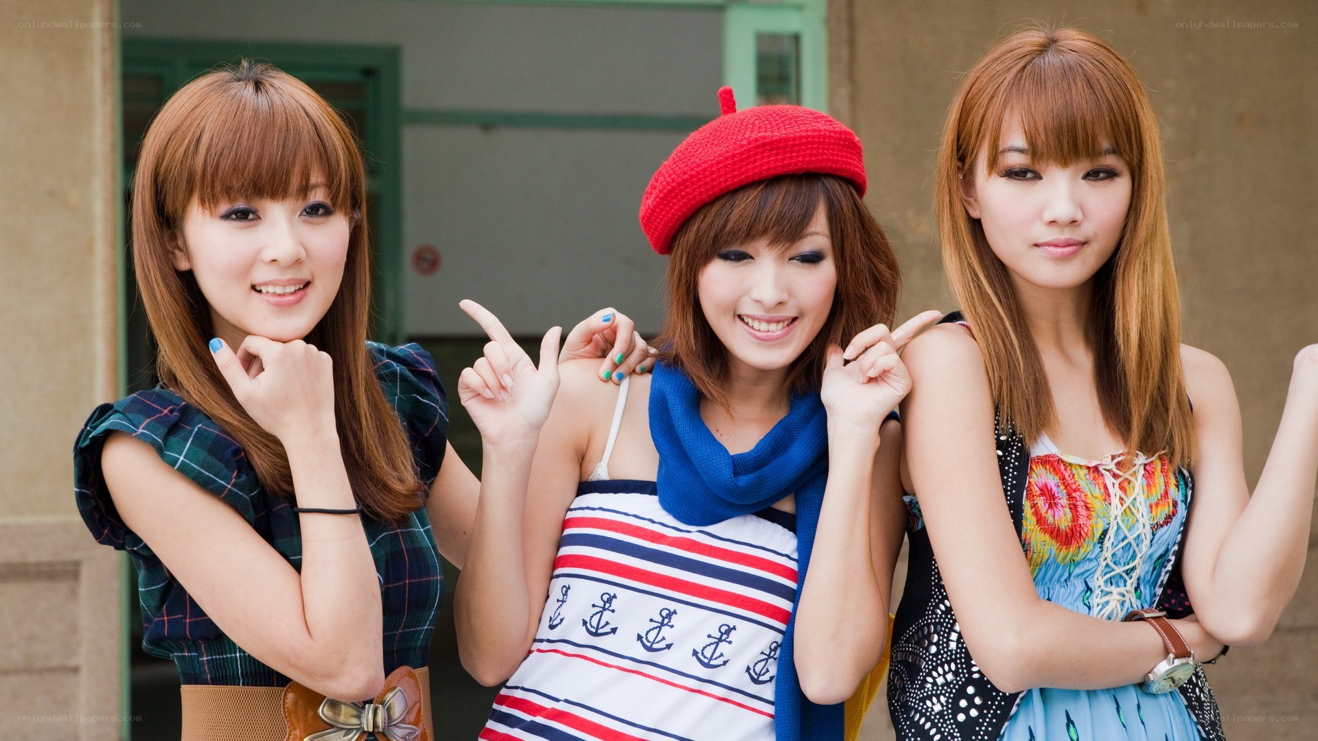 three young women posing together