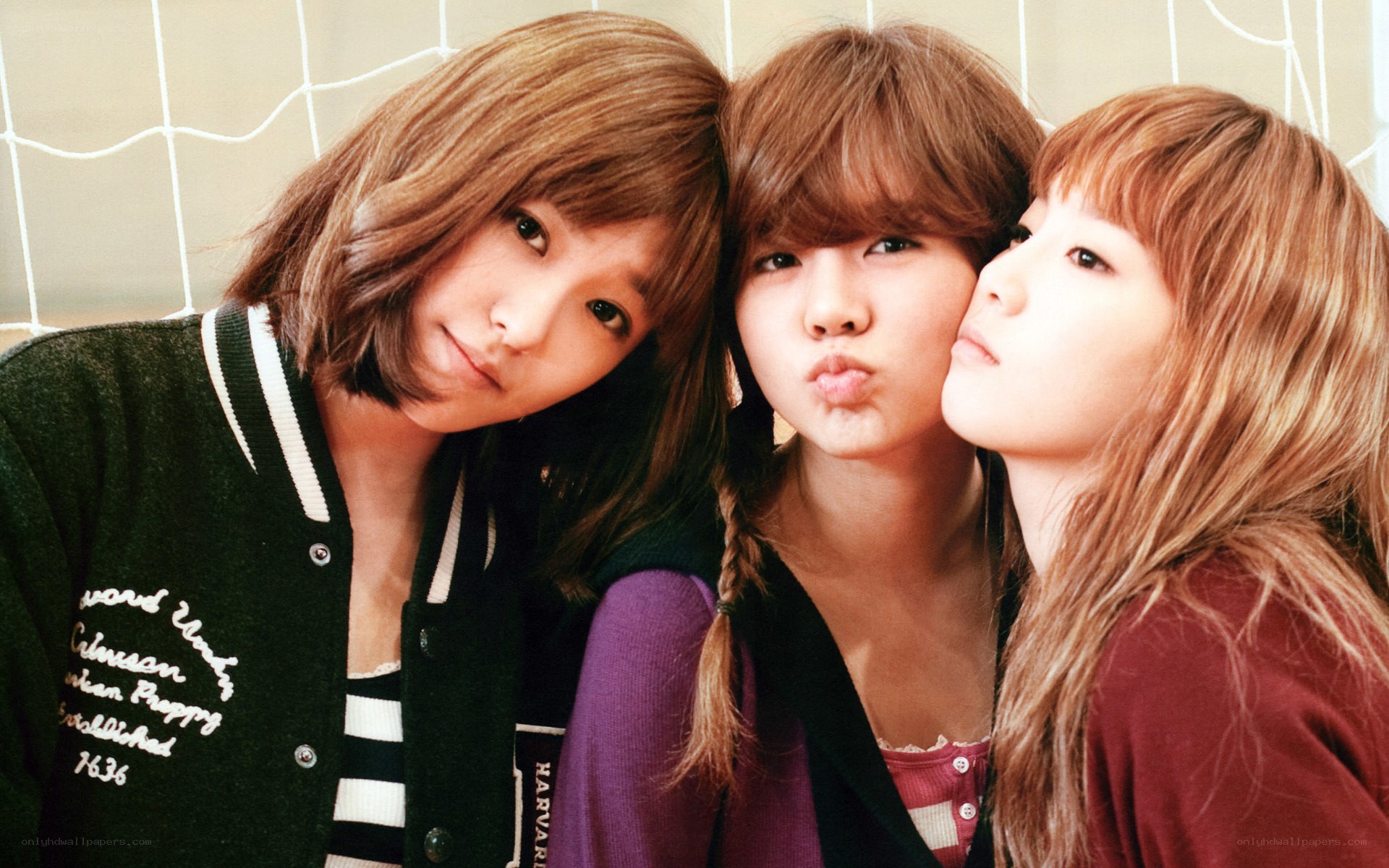 three young women posing together