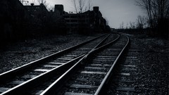 Abandoned monochrome railroad tracks
